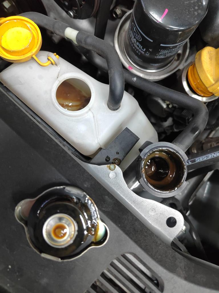 SUBARU XV2.0 Why does my coolant look like chocolate milk